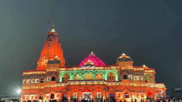 Prem Mandir temple illuminated in stunning shades of pink and purple at night, capturing the divine atmosphere of Vrindavan&rsquo;s sacred landmark. The architectural brilliance 