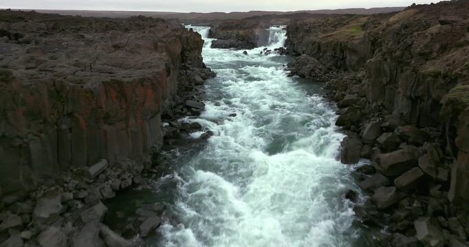 Experience the mighty force of Aldeyjarfoss with this drone shot featuring roaring glacial waters, rugged basalt formations, and breathtaking scenery from one of Iceland&rsquo;s most dramatic waterfalls.