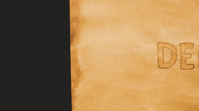 Democracy. Human rights. The word is handwritten on aged brown paper. Movement from right to left. 4k video. Layout, concept.