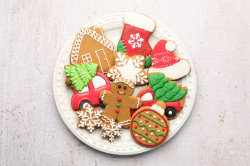 Tasty gingerbread cookies on white textured table, top view. Christmas treat
