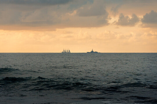 Sailing ship on cloudy Portizuelo beach horizon