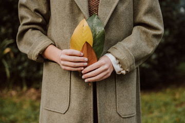 Hands holding leaves symbolizing sustainable living