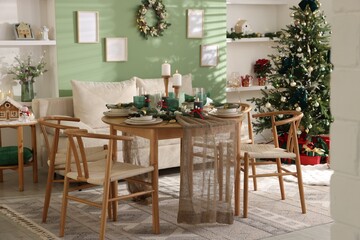 Festive table setting with Christmas decor indoors