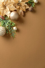 Aesthetic vertical Christmas corner border with golden poinsettia, pine branches, and neutral ornaments for design.