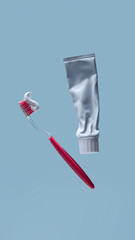 Toothbrush with toothpaste and plastic tube on blue background with empty copy space for dental clinic advertising, oral hygiene awareness and professional healthcare banner
