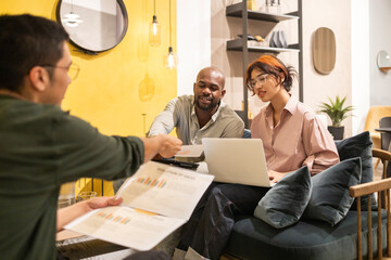 Collaborative team working in modern coworking office