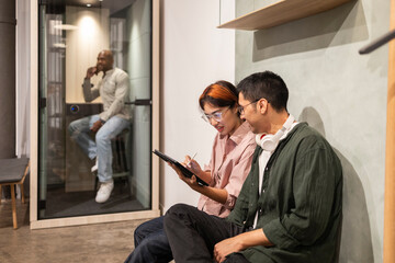 Team collaboration in modern coworking office setting