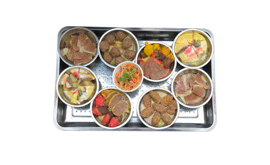 Traditional Dungan wedding dish &ldquo;Shchi&rdquo; served in nine metal bowls on a tray.