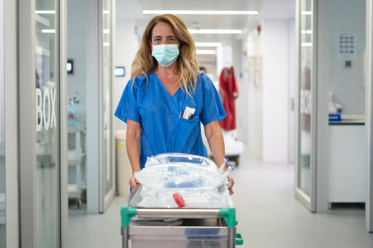 Nurse performing critical care in intensive care unit