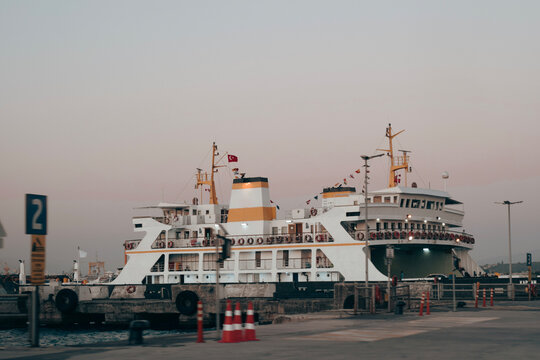 Docked ferry at sunset in a harbor setting