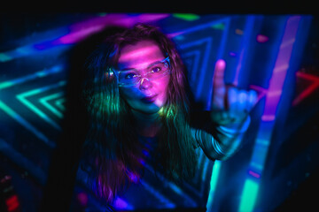 Woman interacting with futuristic LED VR technology