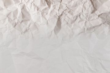 Crumpled white paper background.