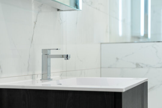 Modern bathroom interior with marble fixtures in London