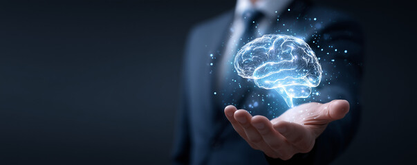 Business professional holding a glowing digital brain, representing artificial intelligence and innovation in technology