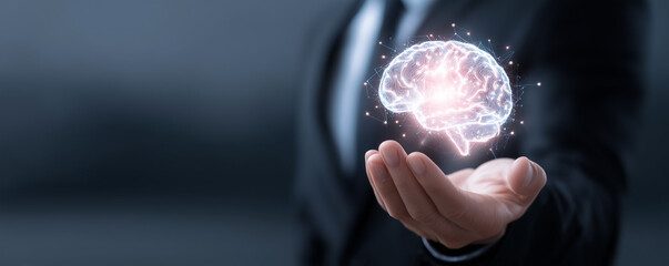 Business professional holding a glowing digital brain, representing artificial intelligence and innovation in technology