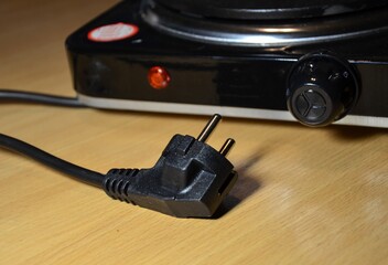 electric plug of an electric stove close-up. concept of using household electrical appliances
