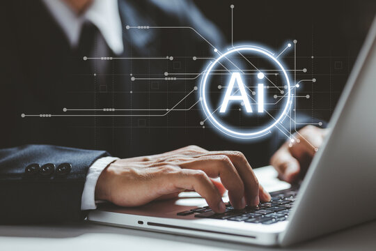 A professional typing on a laptop with a glowing AI interface graphic, representing artificial intelligence, machine learning, smart automation, and advanced digital innovation in modern business.