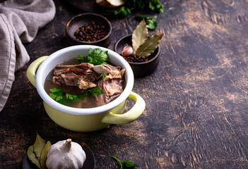 Boiled bone broth or bouillon with meat
