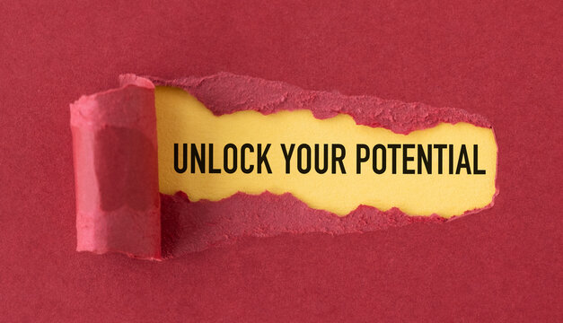 A torn piece of paper with the words Unlock Your Potential written on it.