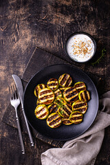 Grilled zucchini with sauce, vegan dish