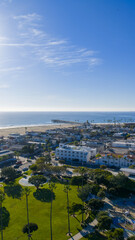 Fototapeta premium Aerial shot along the coastline at the Newport Beach Pier in Newport Beach California USA