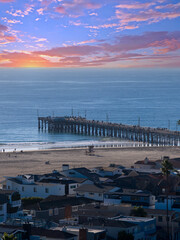Fototapeta premium Aerial shot along the coastline at the Newport Beach Pier in Newport Beach California USA