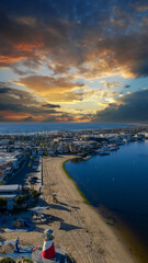 Aerial shot along the coastline and Newport Bay at Marina Park in Newport Beach California USA