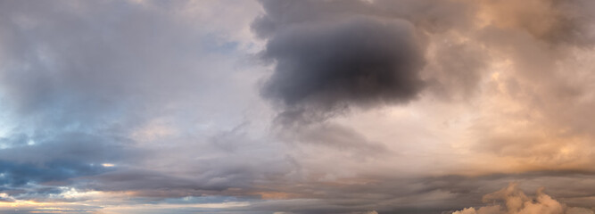 Obraz premium Dramatic Sunset Sky With Heavy Clouds Over Horizon, Moody Cloudscape At Dusk