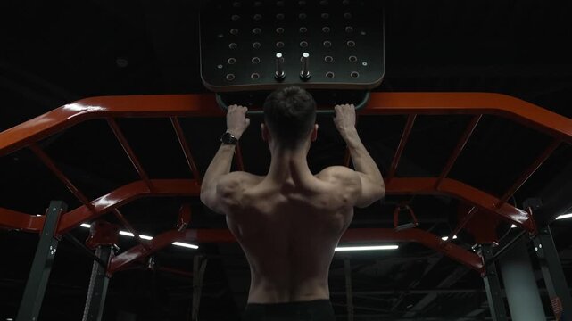 Strong athlete. Man pullup at gym. Muscular man sportsman with strong back muscle. Sport pullup workout. Sport training. Man sportsman do pullup exercise. Muscular biceps and triceps. 4k footage