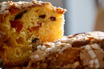 Almond-Topped Panettone with One Slice Revealed — Side Perspective