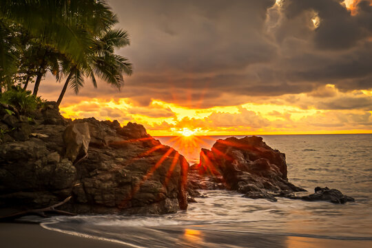 Sunset over a rocky beach in Costa Rica