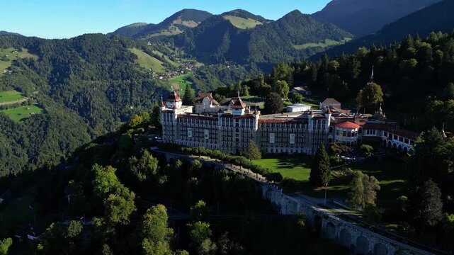 Aerial drone footage of SHMS Swiss Hotel Management School campus in Montreux, Switzerland, showcasing modern architecture, scenic Lake Geneva, and surrounding mountains