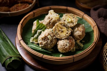 Thai Deep fried Banana with Pounded Unripe Rice (Khao Mao Tod) on bamboo basket,Crispy Fried Banana balls
