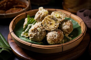 Thai Deep fried Banana with Pounded Unripe Rice (Khao Mao Tod) on bamboo basket,Crispy Fried Banana balls