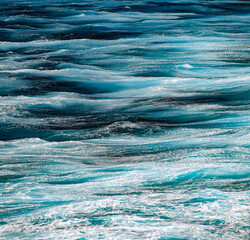 Sea surface aerial view. Background shot of clear sea water surface. Blue sea water in calm. Sea...