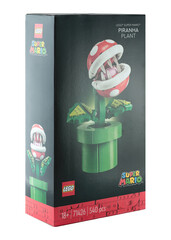Naklejka premium Pack of a Lego construction created in collaboration with Nintendo, featuring a buildable Piranha Plant figure from Super Mario video game, isolated on transparent background