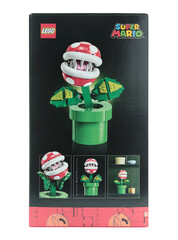 Fototapeta premium Pack of a Lego construction created in collaboration with Nintendo, featuring a buildable Piranha Plant figure from Super Mario video game, isolated on transparent background