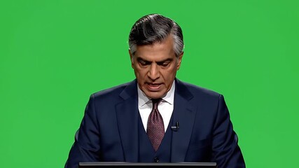 Confident Businessman Delivering a Keynote Speech on Green Screen A Powerful Presentation on Corporate Strategy and Global Business Trends.