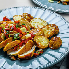 Healthy Chicken and Roasted Potato Dinner on Blue Plate