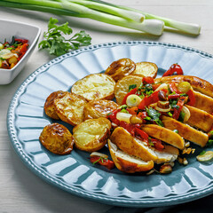 Sliced Chicken Fillet with Herb Potatoes and Pepper Salsa