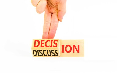 Discussion and decision symbol. Concept words Discussion and Decision on beautiful wooden cubes. Beautiful white background. Businessman's hand. Business discussion and decision concept. Copy space.