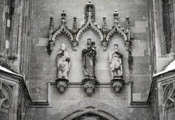 Gothic architecture detail of the medieval stone door sculpture at  “Müntzer unserer lieben Frau” (Church of Our Lady). Constance, Baden Württemberg, Germany.