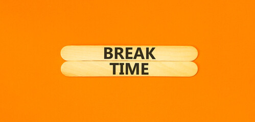 Break time symbol. Concept word Break time on beautiful wooden sticks. Beautiful orange paper background. Business break time concept. Copy space.