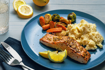 Healthy Salmon Dinner Plate with Mashed Potatoes and Lemon