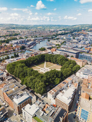 Obraz premium Bristol UK: 28th Jul 2025: Drone view of Bristol Queen Square. Prepares for an exciting event with setup taking place in the heart of the city