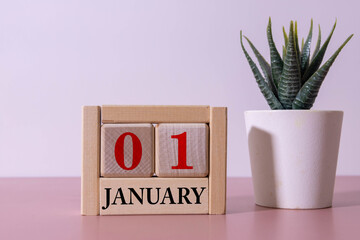Wooden perpetual calendar showing the 1st of January.