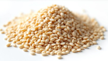 Fototapeta premium Pile of white sesame seeds on white surface. Close up photo of sesame seeds. Sesame seeds background. Food ingredient for cooking. Healthy organic food. Natural diet.