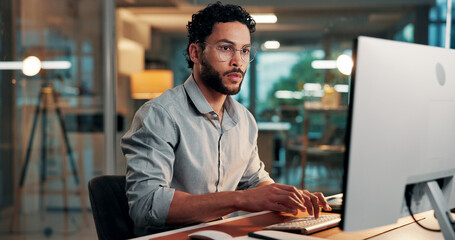 Serious, employee and man with computer, office or reporter with article on web, typing and...