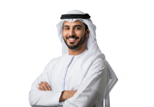 A smiling young arab man wearing traditional white kandura and ghutra with crossed arms isolated on transparent background