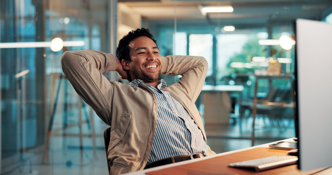 Computer, relax and smile with business man at desk in office for complete task or satisfaction. Done, hands behind head and PC with happy employee in workplace for planning, research or stretching - Powered by Adobe
